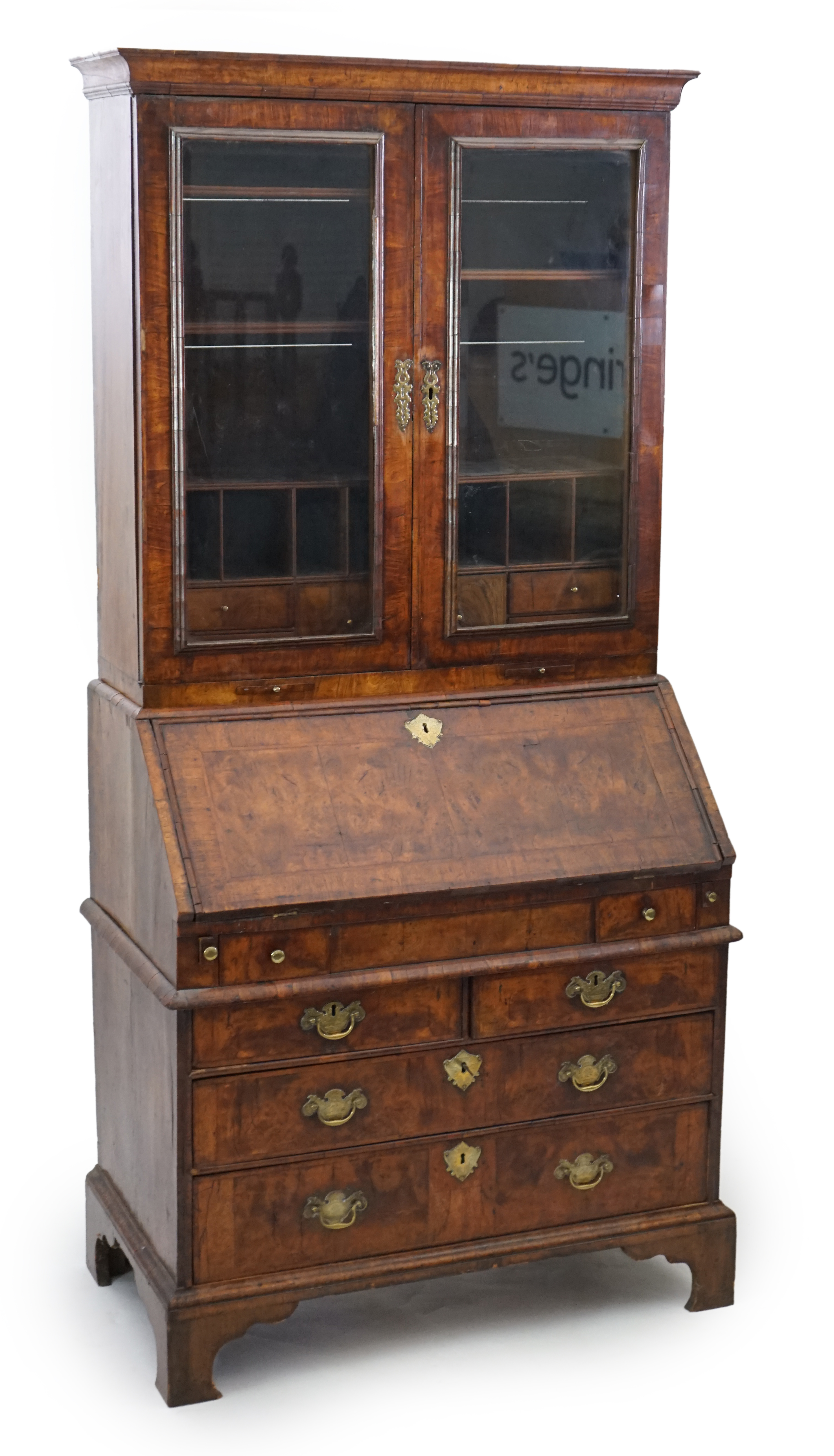 An early 18th century walnut bureau bookcase